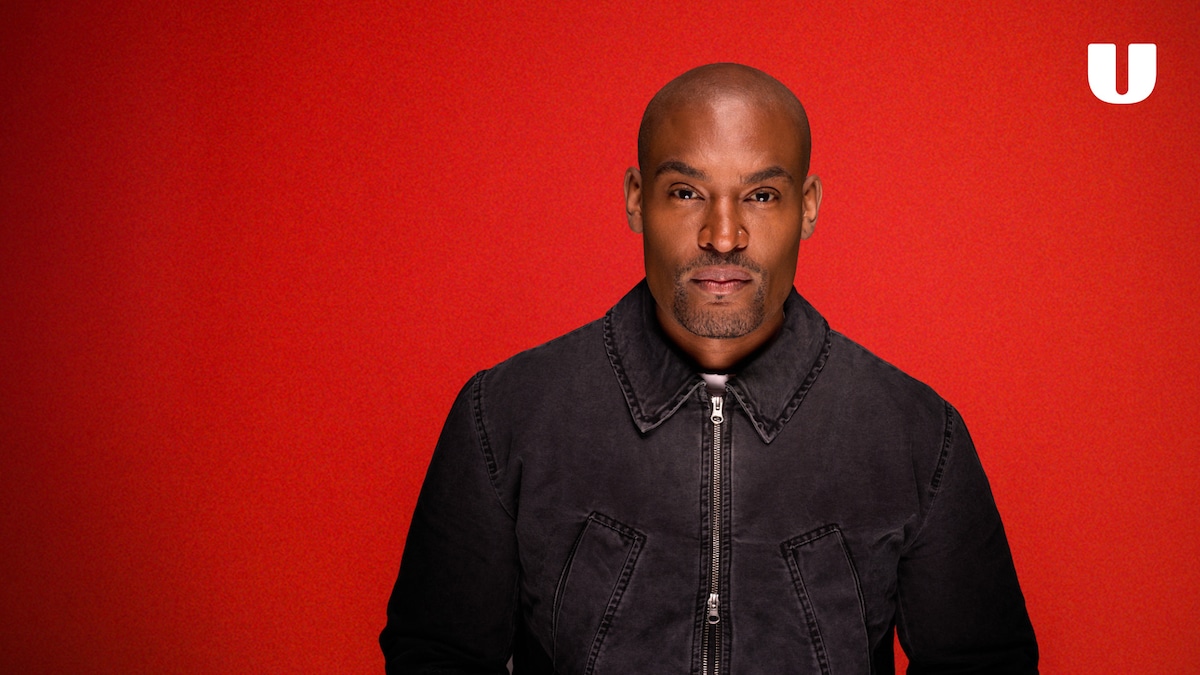 Paul C. Brunson in the Red Flag promotional portrait, against a red background with the U logo